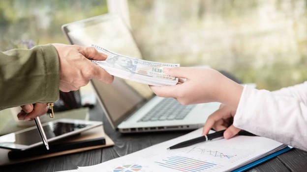 A man catching money in his hand