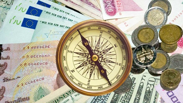 compass on different countries currencies